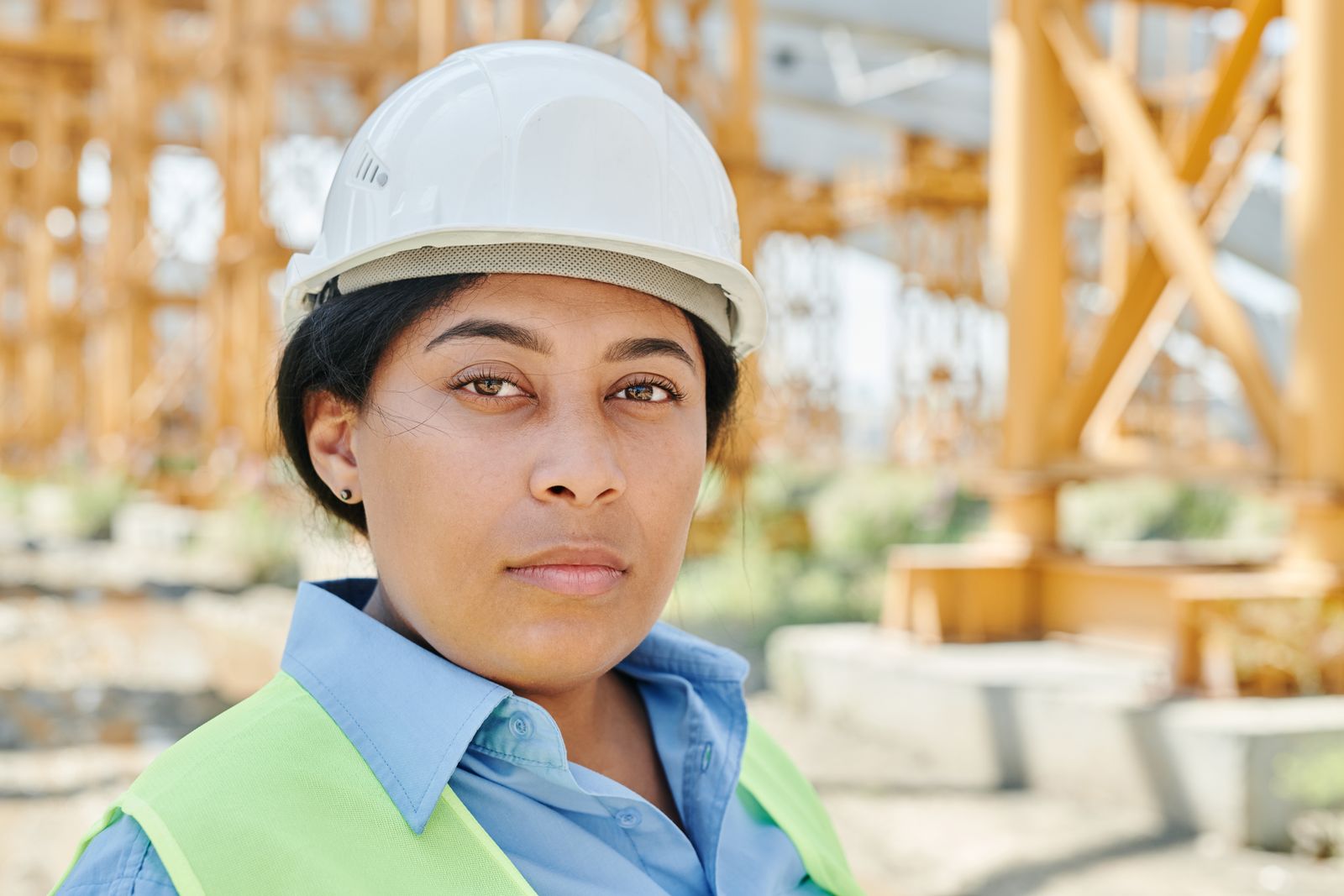 Site supervisor in hard hat and safety vest